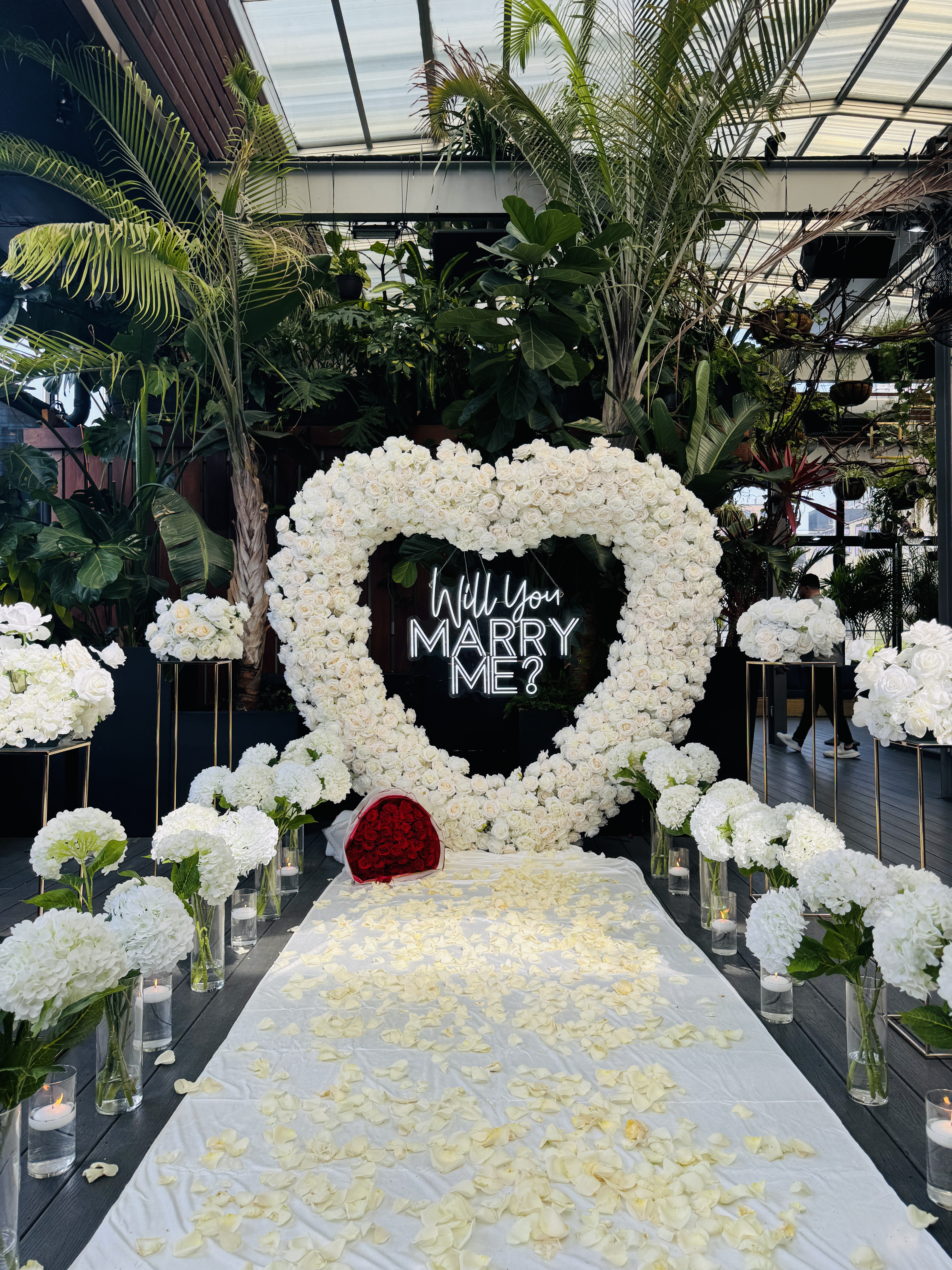 Rooftop proposal setup in New Jersey with luxury decor and romantic city view